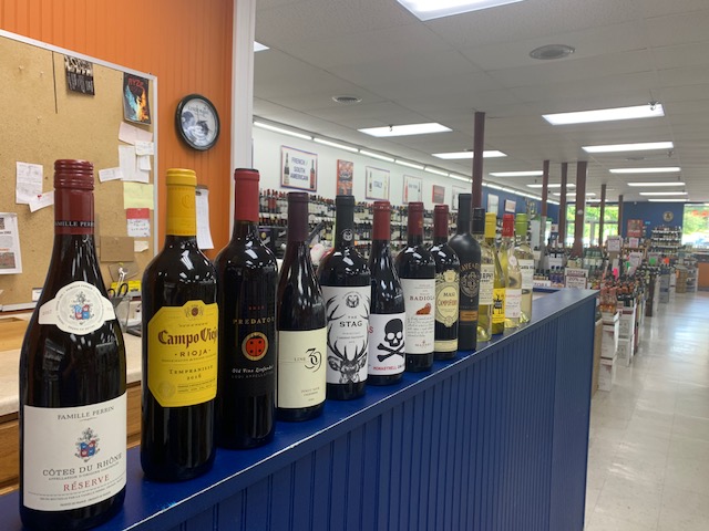 syracuse liquor store counter top with wines on top